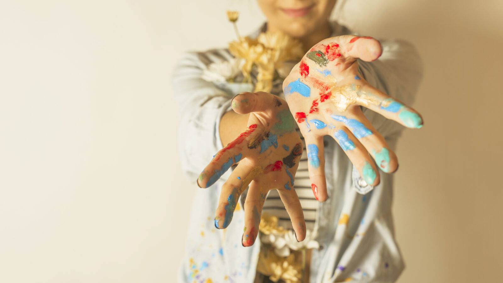 portrait-female-artist-with-paint-hands